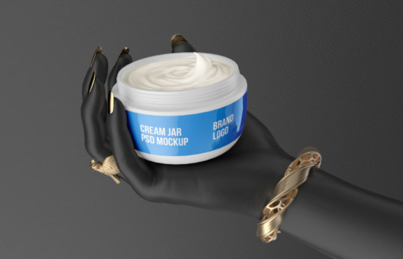 Cosmetic Jar White Cream On Black Hand PSD Mockup